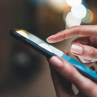 a person using their pointer finger to interact with their mobile phone